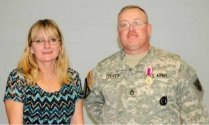 Here is a photo of me and my wife during my retirement service. I retired after 25 years in the U. S. Army. - Paul