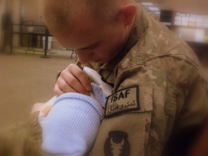 This picture of my hero was taken April 16, 2011. This was one week after our son was born. SPC Brandon Paulton was in the airport leaving to go back to Afghanistan after his 2 week leave. This is one of my favorite photos of them. This photo brings back a lot of emotions. That was a very hard day. I was saying goodbye again to the love of my life and he had to say goodbye to his newborn son. There was a lot of tears that day but he came home safe. Thank you for sharing these photos! - Kelsey