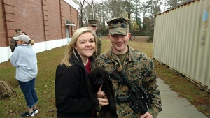 My husband, and I with our pup the day he deployed - Love, Alexis