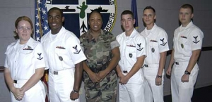 Jonathan Holcomb and fellow shipmates after being frocked to Petty Officer 3rd Class at Naval Security Detachment Guam, December 2006