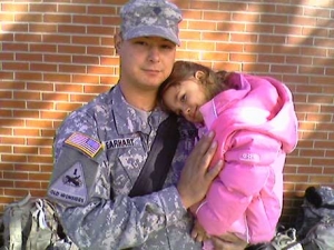 Veteran of the United States Army, Specialist Nathan Earhart with his daughter Mackenzie the day he deployed to Iraq for his 2nd tour