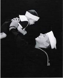 MA3 Jonathan L. Holcomb of the United States Navy and his son at 6months old, December 2006